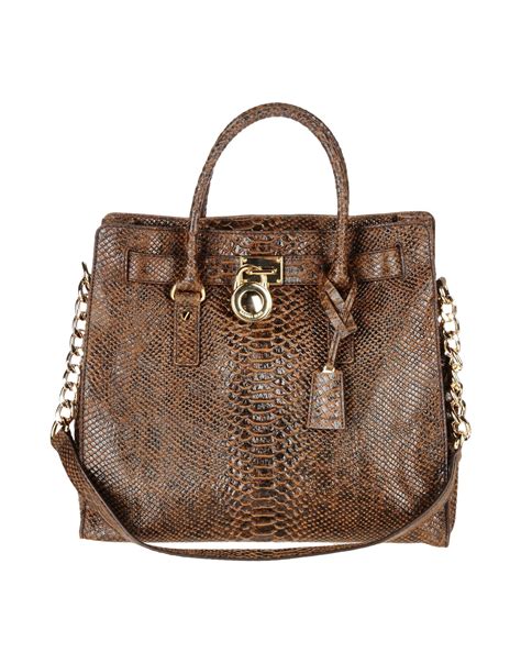 new michael kors satchel brown|Michael Kors brown purse.